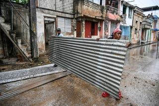 Hurricane Melissa live updates: ‘Extremely dangerous’ storm strengthens towards Cuba after devastating Jamaica Residents hold pieces of a roof before Hurricane Melissa arrives in Santiago de Cuba, Cuba, on Tuesday. The storm is expected to hit Cuba early Wednesday morning